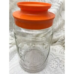 Vintage Anchor Hocking Wharf Jar: Embossed Glass Container with Orange Lid